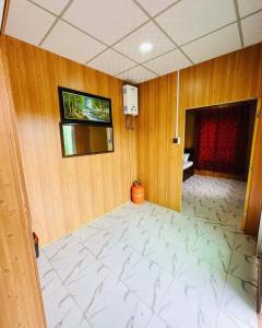 En eller flere senge i et værelse på Malam Jabba Cottages