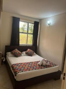 Una cama o camas en una habitación de Hotel Tierra Santa Santa Fe de Antioquia 19 fotos más