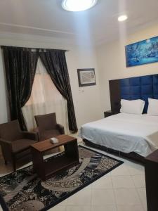 Postel nebo postele na pokoji v ubytování فخامة المصيف للشقق المخدومة 2