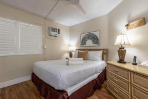 a bedroom with a large bed and a window at Maui Sunset A413 in Kihei +60 photos