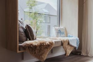 Et opholdsområde på NEU "Rügen Resørt Sagard" großzügiges, gemütliches Familienhaus "Lykke" mit Terrasse