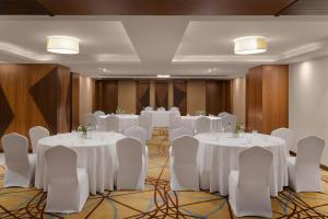 a conference room with white tables and chairs at The Fern, Jaipur, Series by Marriott in Jaipur +60 photos