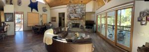 a living room with a couch and a fireplace at Torreon Getaway on the Greens with hot tub, 4 bedrooms, sleeps 10 in Show Low