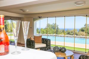 a living room with a view of a pool at Villa Sakura in Kyrenia