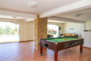 a living room with a pool table in it at Villa Sakura in Kyrenia