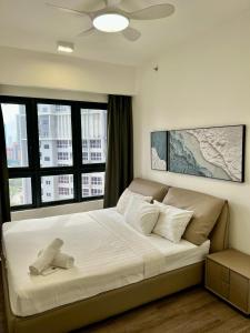 a bedroom with a bed with a teddy bear on it at Agile Residence Bukit Bintang by Skyline Homes in Kuala Lumpur +91 photos