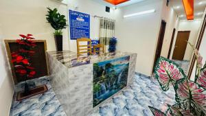 a room with a counter with flowers and plants at Hotel Prime City Residential in Dhaka +41 photos