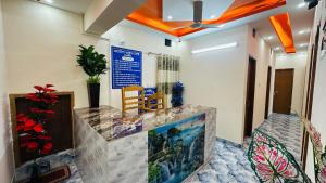 a lobby with a large aquarium in a room at Hotel Prime City Residential in Dhaka