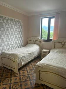 En eller flere senge i et værelse på Gyulagarak house