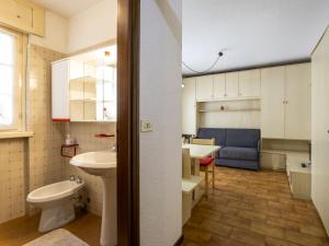 a bathroom with a sink and a toilet in a room at Studio Tigli-2 by Interhome in Madesimo +22 photos
