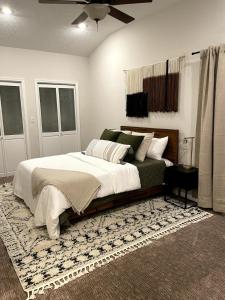 a bedroom with a large bed and a rug at Apple Mountain Retreat at Shenandoah National Park 