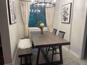 a dining room table with two chairs and a window at Apple Mountain Retreat at Shenandoah National Park 