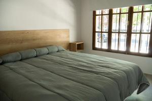 Postel nebo postele na pokoji v ubytování Grin Apartments