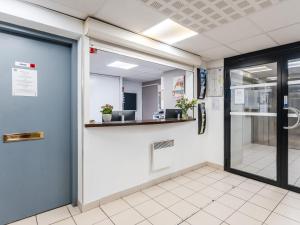 Lobbyen eller receptionen på Séjours & Affaires Nantes La Beaujoire