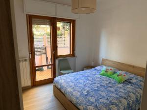 a bedroom with a bed with two stuffed animals on it at La DA MA Shila Winter Escape in Francavilla al Mare