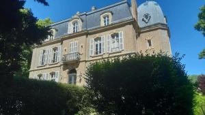 a large brick building with a tower on top at Domaine des Monts de la Baie in Mareuil-Caubert +7 photos