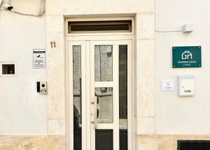 a door on the side of a building at Gasparro House in Turi +7 photos