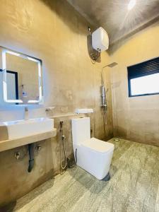 a bathroom with a toilet and a sink at Bella Nova in Ahangama +25 photos