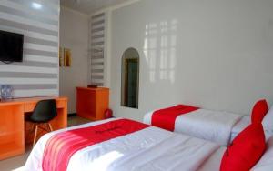 Postel nebo postele na pokoji v ubytování Hotel Grand illa palopo