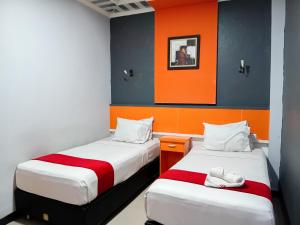 Postel nebo postele na pokoji v ubytování Hotel Grand illa palopo