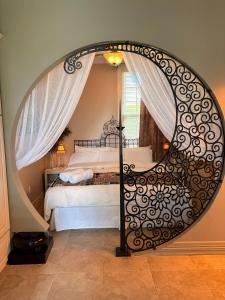 a bedroom with a bed and a large mirror at Caye Caulker Boutique Guesthouse 3 in Caye Caulker