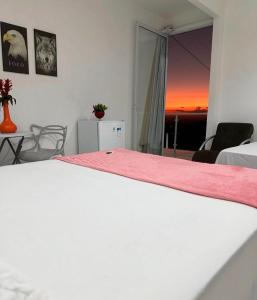 Postel nebo postele na pokoji v ubytování The One Suíte