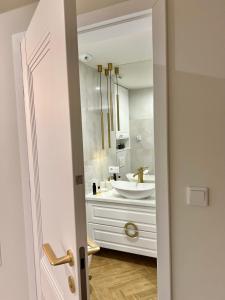 Et badeværelse på Mia Baltic apartament Greeneri Park