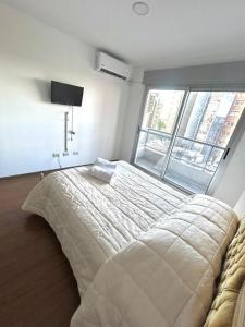 En eller flere senge i et værelse på Moderno monoambiente