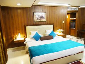 Postel nebo postele na pokoji v ubytování Hotel Galaxy