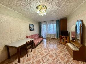 a living room with a couch and a table at Apartmány Cestovatele in Jáma František