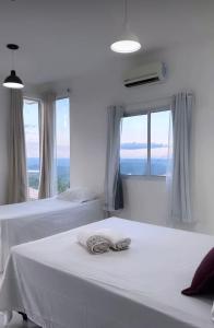 Postel nebo postele na pokoji v ubytování The One Suíte