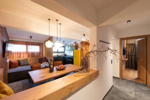 a living room with a couch and a table at Hotel Garni Mirabell in Ischgl