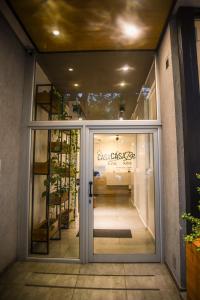 a front door of a store with a sign on it at Casa Be Suites in Rosario