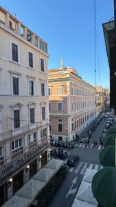 a view of a city street with cars and buildings at moonstar guesthouse termini in Rome