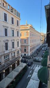 a view of a city street with cars and buildings at moonstar guesthouse termini in Rome