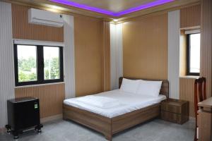 Кровать или кровати в номере Hotel Cốc Cốc 2