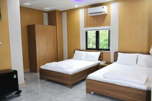 Кровать или кровати в номере Hotel Cốc Cốc 2 +11 фотографий