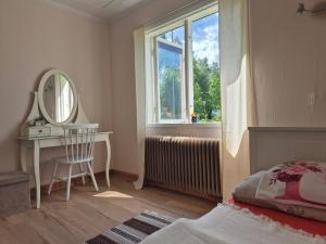 En eller flere senge i et værelse på Ferienhäuschen in Ställdalen