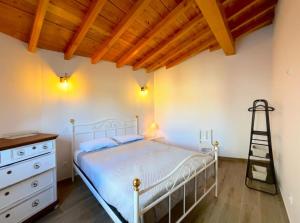 Ένα ή περισσότερα κρεβάτια σε δωμάτιο στο Casinha do Palheiro T1-Casinhas de Trás das Eiras