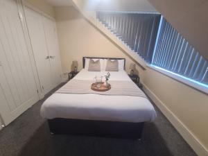 Giường trong phòng chung tại Stadium Apartments +4 ảnh