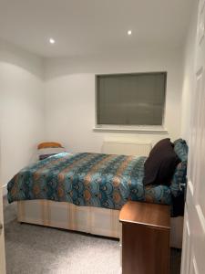 En eller flere senge i et værelse på The Croft Farmhouse Apartments