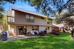 a house with a yard with a patio at Horseshoe Bay Getaway in Horseshoe Bay