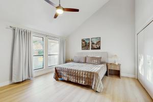 a bedroom with a bed and a ceiling fan at Horseshoe Bay Getaway in Horseshoe Bay