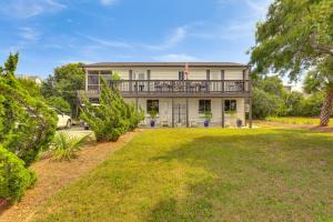 a large house with a balcony and a yard at Steps to Sand! Topsail Beach Group Getaway! in Surf City