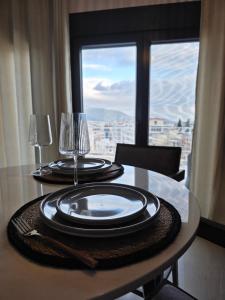 a dining room table with a view of a city at Mimis Skyline in Xanthi