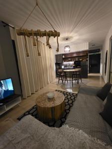 a living room with a couch and a table at Mimis Skyline in Xanthi