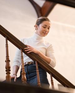 a woman is walking down the stairs at Fortune boutique old town in Poznań +82 photos