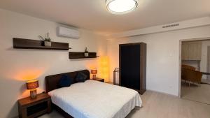 Ένα ή περισσότερα κρεβάτια σε δωμάτιο στο CasaBruno Vendégház Celldömölk