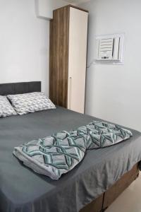 En eller flere senge i et værelse på Flat da Belly 904-A