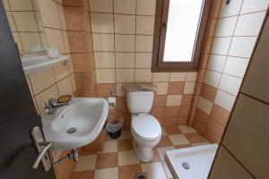 a small bathroom with a toilet and a sink at Mesie Nicola 700  +34 photos